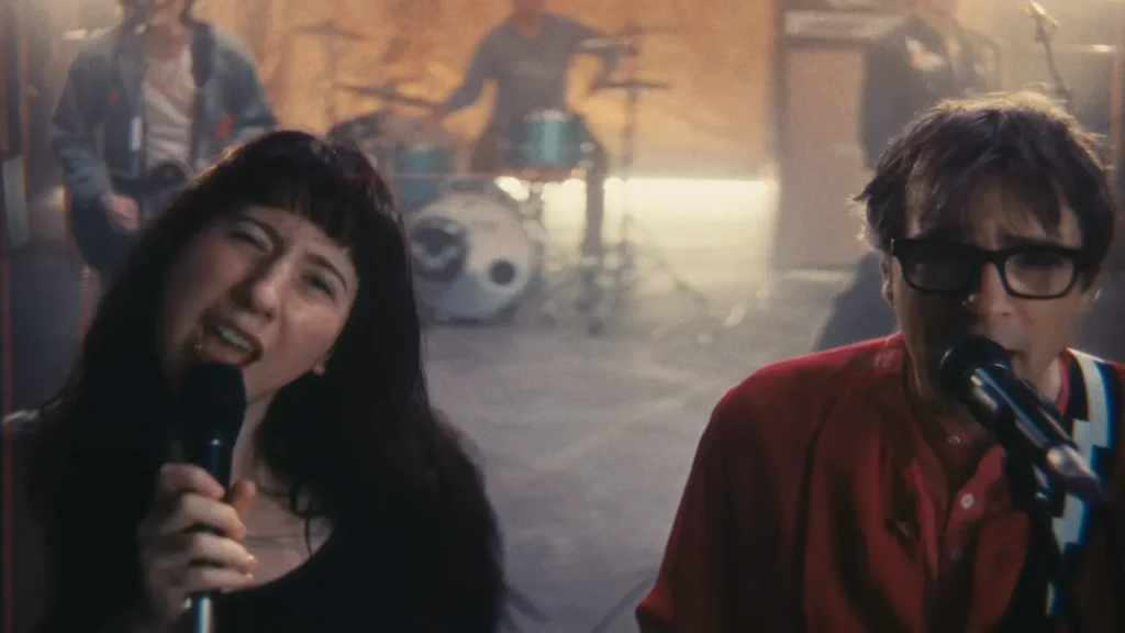 Weezer. Wednesday's Karly Hartzman and in 'We Might As Well Be Strangers'